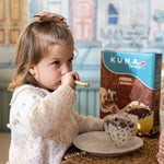 Caja Cereal Cacao Kuna Foods de cereales listos para consumir, con diseño marrón y azul en porciones